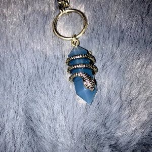 Silver and blue necklace with snake a round crystal